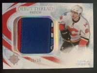 2010-11 Ultimate Collection Debut Threads Patch T.J. Brodie #21 of 35.webp